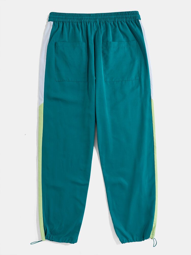 Pantalones De Puño Con Cordón Informal Sueltos Con Rayas Laterales En Contraste Para Hombre