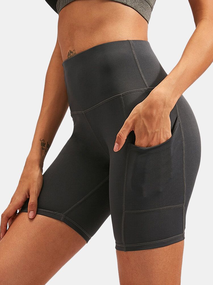 Pantalones Cortos Deportivos De Yoga De Secado Rápido De Color Sólido Para Mujer Con Bolsillo Lateral