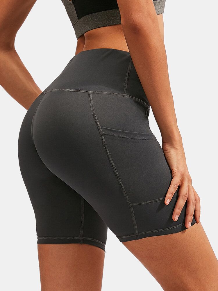 Pantalones Cortos Deportivos De Yoga De Secado Rápido De Color Sólido Para Mujer Con Bolsillo Lateral