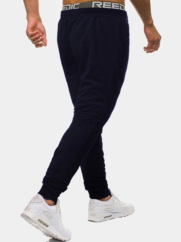 Pantalones Deportivos De Algodón Para Hombre Con Bolsillo Con Estampado De Color Sólido Y Cordón