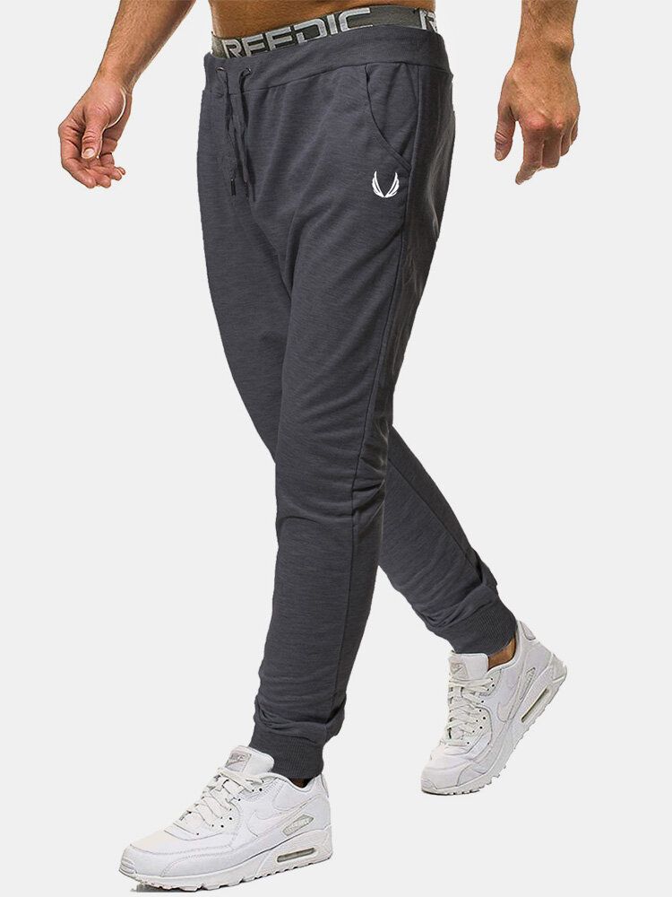 Pantalones Deportivos De Algodón Para Hombre Con Bolsillo Con Estampado De Color Sólido Y Cordón