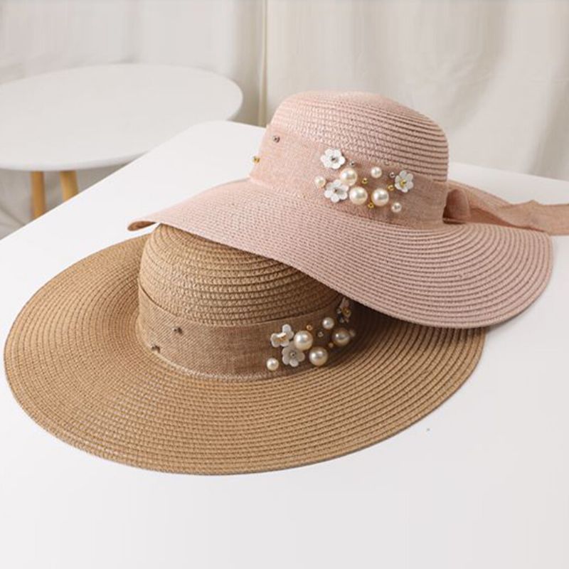 Mujeres Paja Color Sólido Elegante Ala Grande Perla Bowknot Borde Ondulado Visera Sombrero Para El Sol Sombrero De Playa Sombrero De Cubo