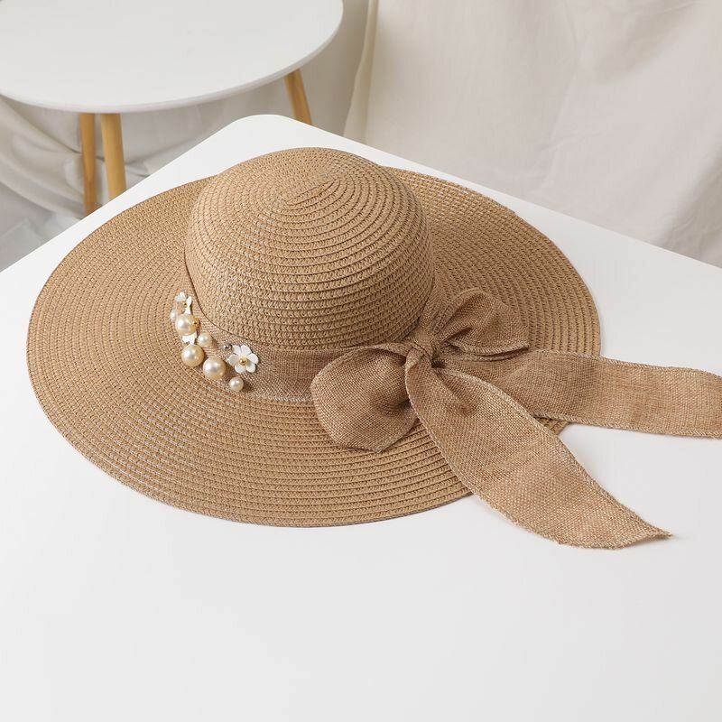 Mujeres Paja Color Sólido Elegante Ala Grande Perla Bowknot Borde Ondulado Visera Sombrero Para El Sol Sombrero De Playa Sombrero De Cubo