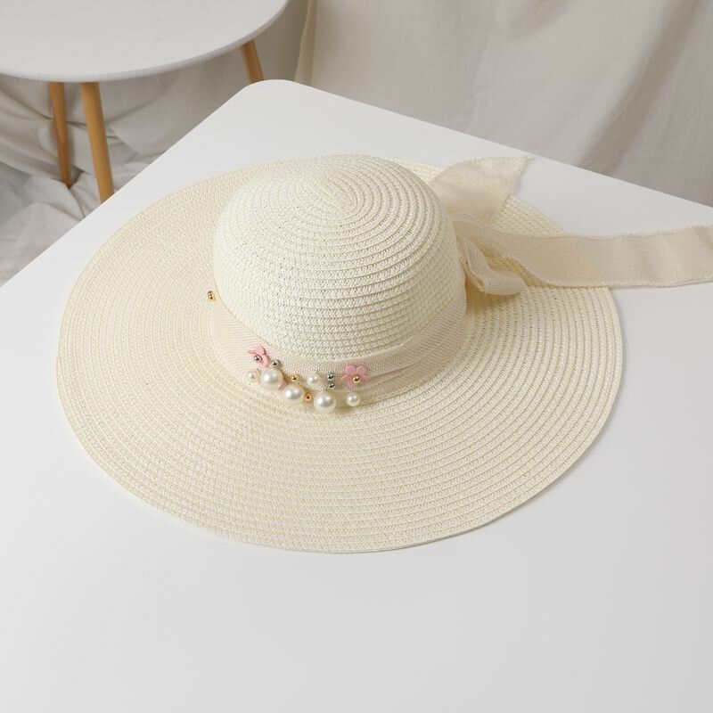 Mujeres Paja Color Sólido Elegante Ala Grande Perla Bowknot Borde Ondulado Visera Sombrero Para El Sol Sombrero De Playa Sombrero De Cubo